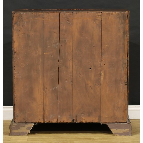 1737 - A George III mahogany bureau, fall front enclosing a small door, small drawers and pigeonholes, abov... 