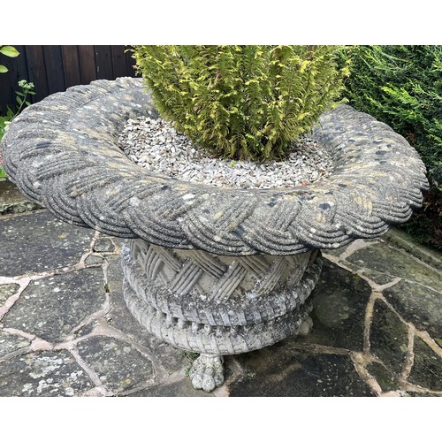 1991 - A large Haddonstone type ‘basket weave’ inverted circular garden urn, lion paw feet, planted with co... 