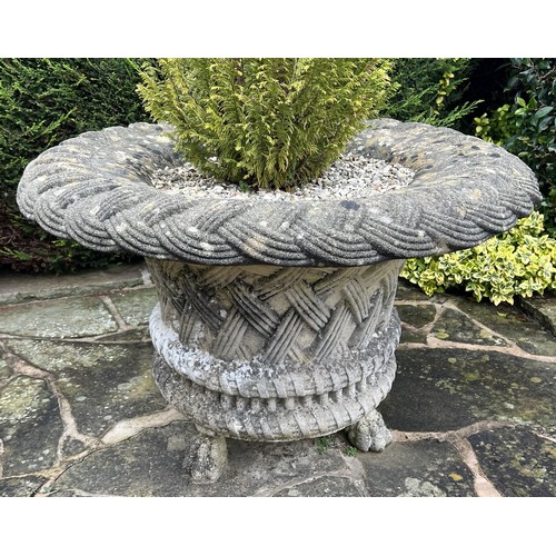 1991 - A large Haddonstone type ‘basket weave’ inverted circular garden urn, lion paw feet, planted with co... 