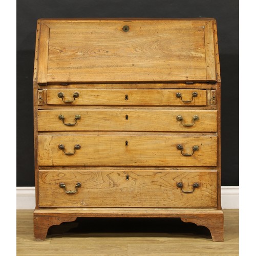 1730 - A George III elm bureau, fall front enclosing a fitted interior, above four long graduated drawers, ... 