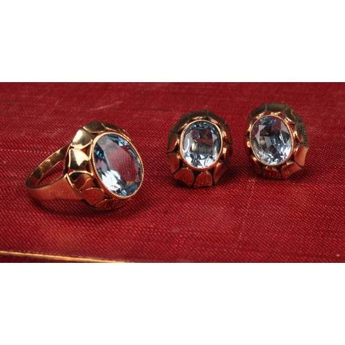 532 - A 9ct gold and aquamarine three piece set, comprising earrings and ring, each with oval stone, total... 