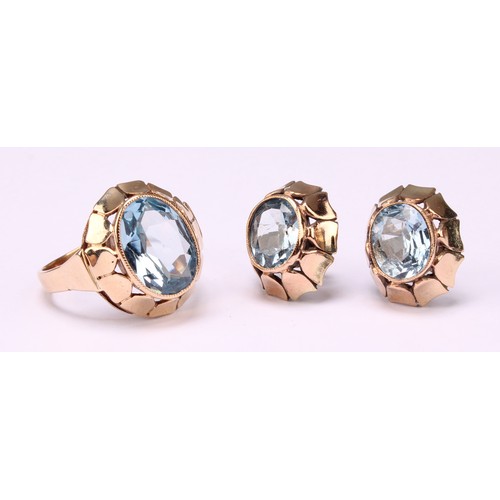 532 - A 9ct gold and aquamarine three piece set, comprising earrings and ring, each with oval stone, total... 