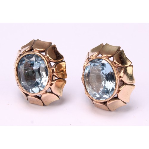 532 - A 9ct gold and aquamarine three piece set, comprising earrings and ring, each with oval stone, total... 