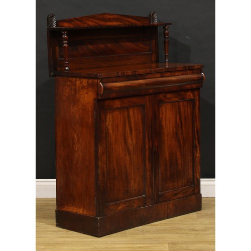 1693 - A George IV mahogany chiffonier, of small proportions, cushion moulded drawer to frieze above a pair... 