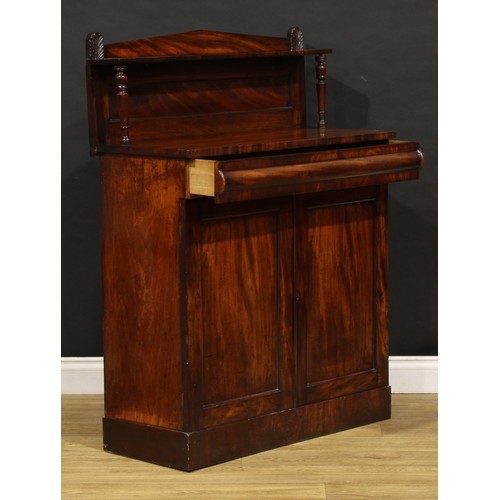 1693 - A George IV mahogany chiffonier, of small proportions, cushion moulded drawer to frieze above a pair... 