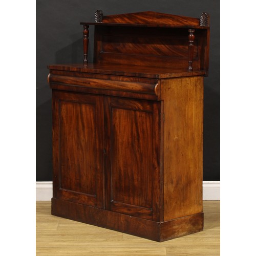 1693 - A George IV mahogany chiffonier, of small proportions, cushion moulded drawer to frieze above a pair... 