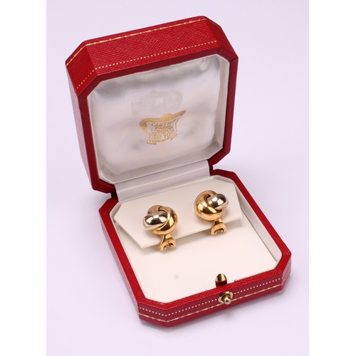 710 - Cartier -  The iconic Trinity design stud earrings, with tricolour knot design, Omega hinge fittings... 