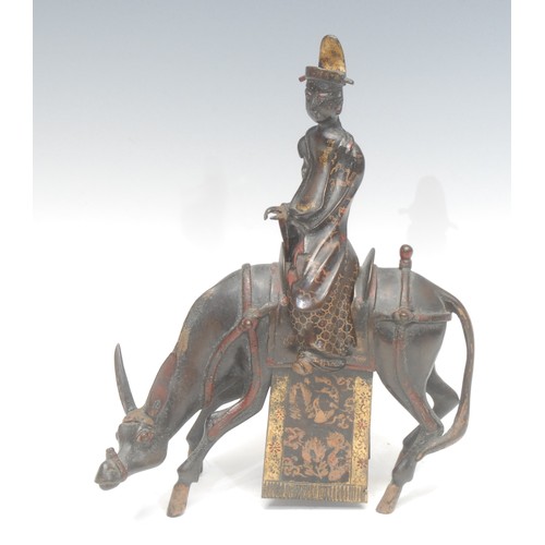 1818 - A Chinese bronze animal zun or ritual vessel, cast as a scholar seated on a horse, picked out in gil... 