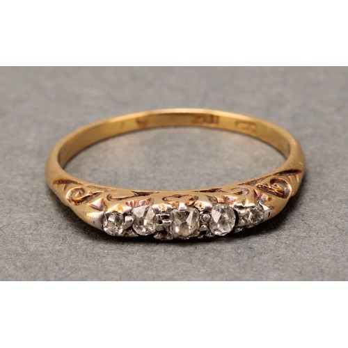 577 - A diamond ring, set with five old mine and rough cut diamonds, estimated diamond weight approx 0.12c... 