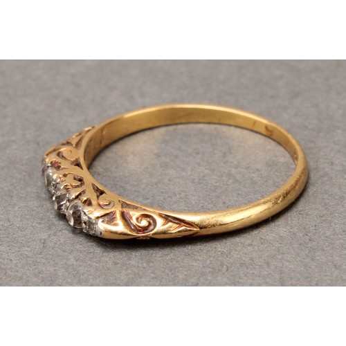 577 - A diamond ring, set with five old mine and rough cut diamonds, estimated diamond weight approx 0.12c... 