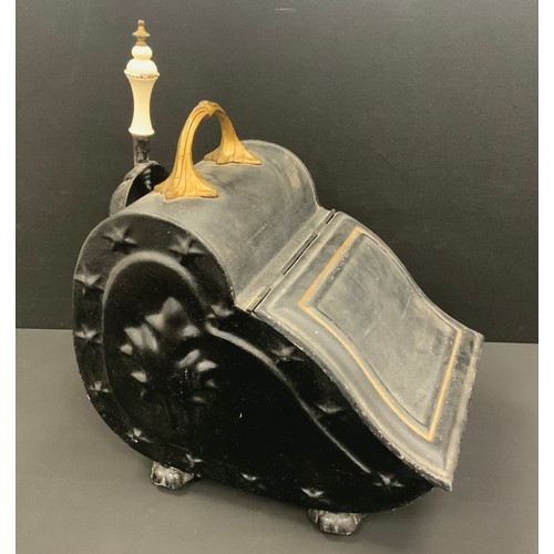 1666 - A Victorian embossed coal scuttle and shovel, leaf and star details, black and gold painted body, pa... 