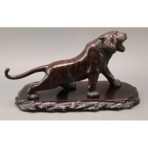 1401 - Japanese School (Meiji period), a pair of two-tone brown patinated bronzes, of tigers, prowling, sig... 