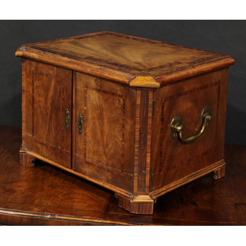 1802 - A 19th century mahogany table cabinet, slightly oversailing moulded herringbone crossbanded top abov... 