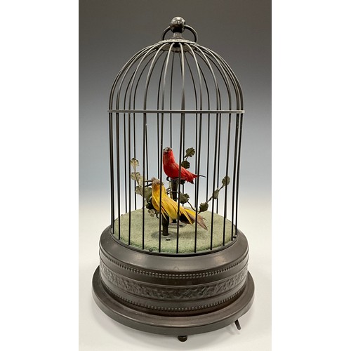 1813 - A 20th century French automation mechanical singing exotic bird pair in a cage, 26cm high, c.1910.