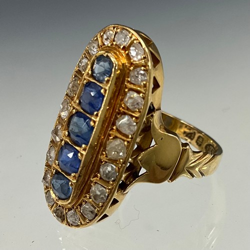 648 - A sapphire and diamond ring, central oval raised platform set with five pale blue sapphires, surroun... 