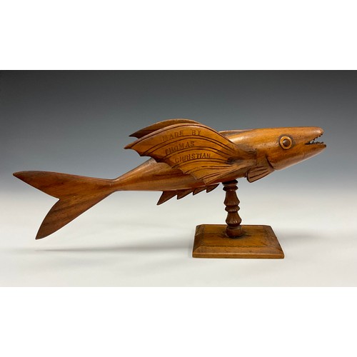 1860 - A Pitcairn Island carved flying fish, with the inscription ‘made by Thomas Christian’ to one wing, a... 