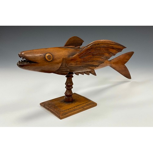 1860 - A Pitcairn Island carved flying fish, with the inscription ‘made by Thomas Christian’ to one wing, a... 