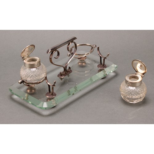 288 - An unusual late Victorian silver and clear glass inkstand, hobnail-cut globular wells, scroll handle... 