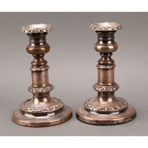 35 - A pair of George IV Old Sheffield Plate telescopic candlesticks, campana sconces with detachable noz... 