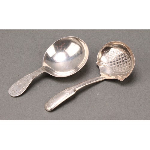 64 - A George III silver caddy spoon, the bowl engine turned with a chequered panel, outlined throughout ... 