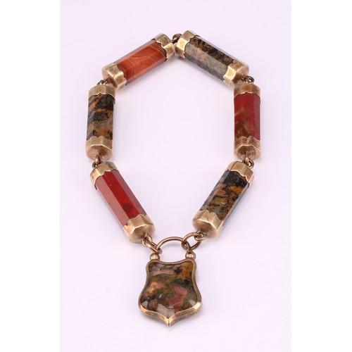 669 - A Victorian Scottish hardstone bracelet, the six octagonal gilt metal bar links with a hardstone set... 