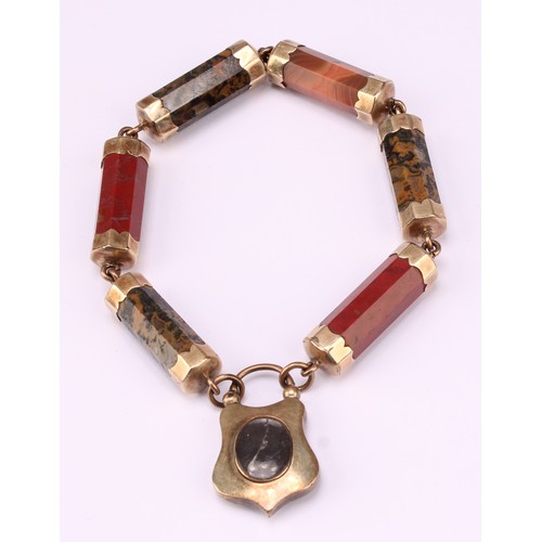 669 - A Victorian Scottish hardstone bracelet, the six octagonal gilt metal bar links with a hardstone set... 