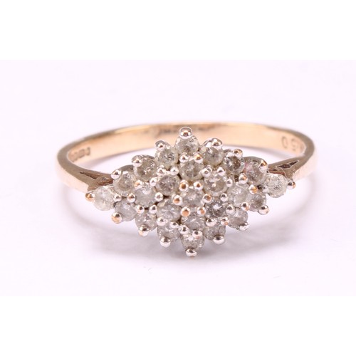 569 - A Diamond cluster ring, stepped triple layer lozenge of round brilliant cut diamonds, total diamond ... 