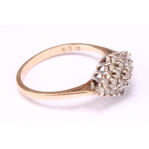 569 - A Diamond cluster ring, stepped triple layer lozenge of round brilliant cut diamonds, total diamond ... 