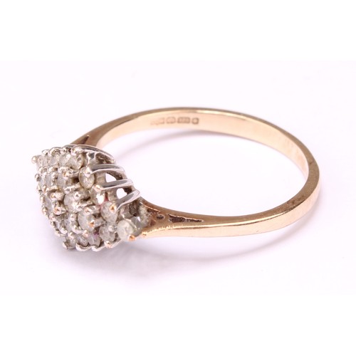 569 - A Diamond cluster ring, stepped triple layer lozenge of round brilliant cut diamonds, total diamond ... 