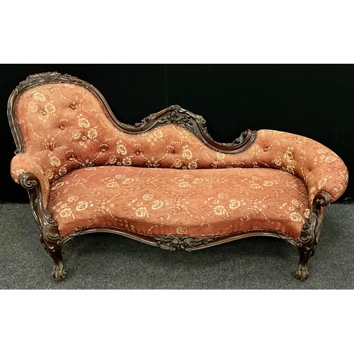 1618 - A Victorian carved walnut chaise longue, spoon-back, with Rococo style scroll arms, carved floral fr... 