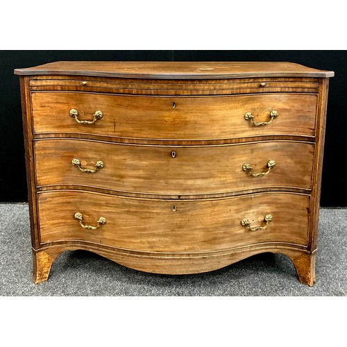 1775 - A George III mahogany serpentine chest of drawers, reeded frieze, brush slide to top, above three gr... 