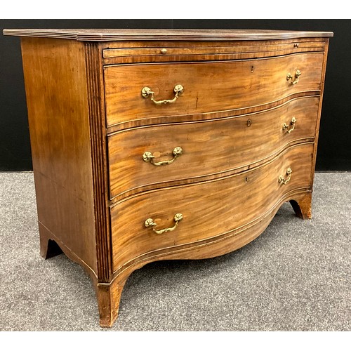 1775 - A George III mahogany serpentine chest of drawers, reeded frieze, brush slide to top, above three gr... 