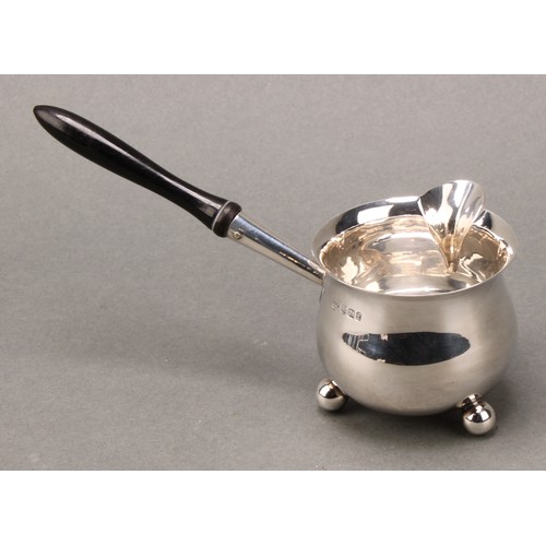 172 - A Victorian silver brandy saucepan, turned ebonised handle terminating in a heart shaped socket, 14.... 