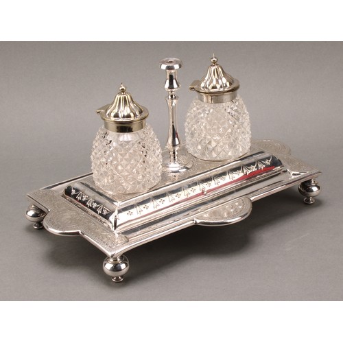 45 - A Victorian E.P.N.S shaped rectangular inkstand, central taperstick flanked by a pair of hobnail-cut... 