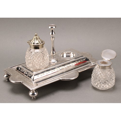 45 - A Victorian E.P.N.S shaped rectangular inkstand, central taperstick flanked by a pair of hobnail-cut... 