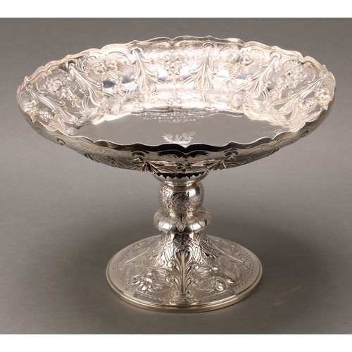 279 - A Victorian silver pedestal table centre comport, in the Gothic Revival taste, shaped circular bowl,... 