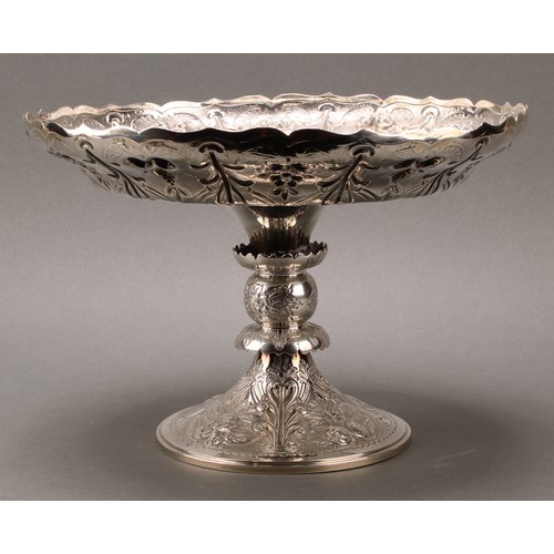 279 - A Victorian silver pedestal table centre comport, in the Gothic Revival taste, shaped circular bowl,... 