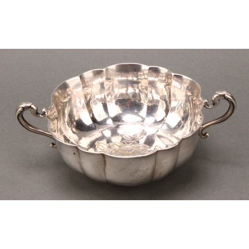 416 - A Spanish Colonial South American silver fluted two-handled bowl, the interior chased with a flower,... 