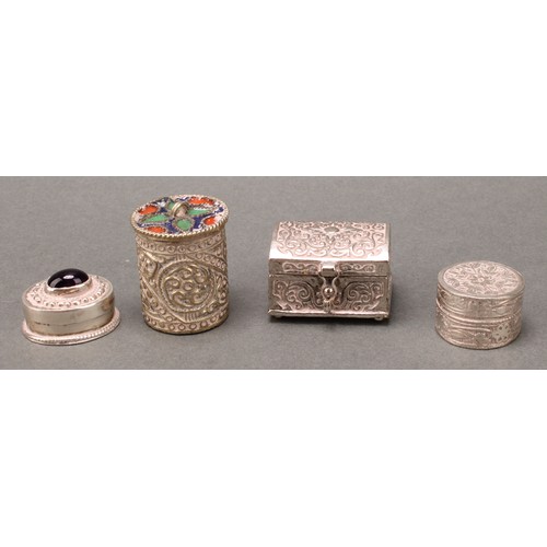 146 - A Middle Eastern silver coloured metal cylindrical box, the push-fitting cover decorated in polychro... 