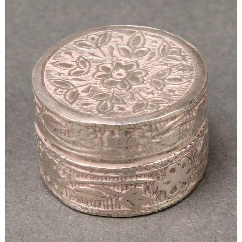 146 - A Middle Eastern silver coloured metal cylindrical box, the push-fitting cover decorated in polychro... 