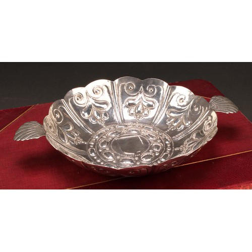 324 - A William & Mary silver sweetmeat dish, fluted and chased, scallop shell lug handles, 24.5cm wide ov... 