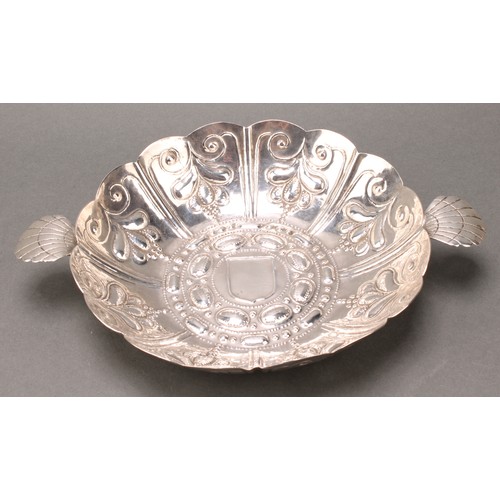 324 - A William & Mary silver sweetmeat dish, fluted and chased, scallop shell lug handles, 24.5cm wide ov... 