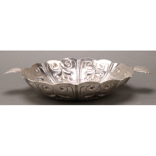 324 - A William & Mary silver sweetmeat dish, fluted and chased, scallop shell lug handles, 24.5cm wide ov... 