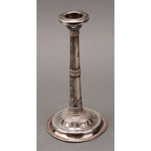 184 - Judaica - a pair of early 20th century Jewish silver candlesticks, typically applied with filigree s... 