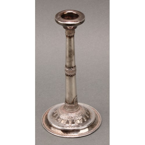 184 - Judaica - a pair of early 20th century Jewish silver candlesticks, typically applied with filigree s... 