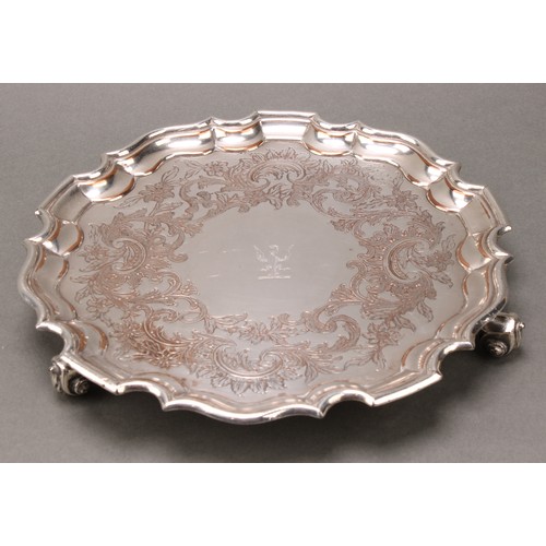 36 - A pair of George/William IV Old Sheffield Plate shaped circular salvers, each chased with a Rococo b... 