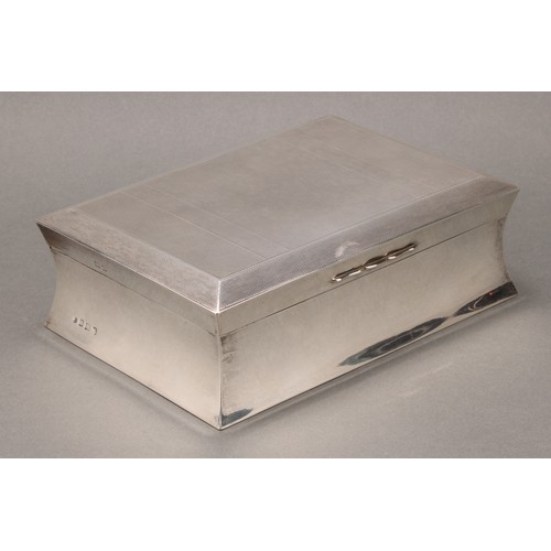 225 - A large Art Deco silver waisted rectangular cigar box, the hinged cover engine turned and enclosing ... 