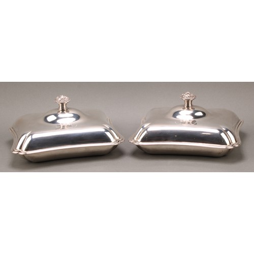 386 - A pair of George III silver incurved rectangular entree dishes, of Irish interest, each finial cast ... 