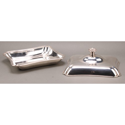 386 - A pair of George III silver incurved rectangular entree dishes, of Irish interest, each finial cast ... 