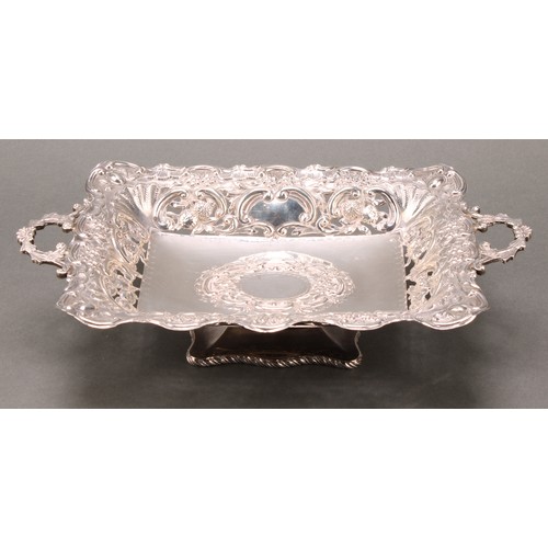 238 - An Edwardian silver rectangular pedestal fruit or sweetmeat dish, pierced and embossed with flowers ... 